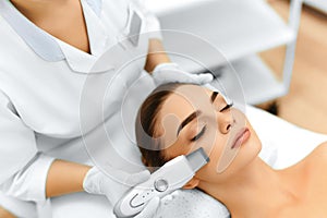 Skin Care. Ultrasound Cavitation Facial Peeling. Skin Cleansing photo