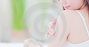 Skin care woman applying sunscreen