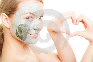 Skin care. Woman in clay mud mask on face. Beauty.