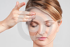 Skin Care. Woman with perfectly clean skin and massage facial lines