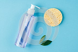 Skin cleanser with a sponge on a blue background. The concept of natural cosmetic