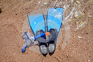 Skin diving equipment standing ready on a beach