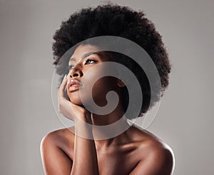 Skin, face and natural beauty, black woman thinking, cosmetics and glow isolated on studio background. Skincare