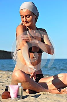 Skin health: woman applying sun block