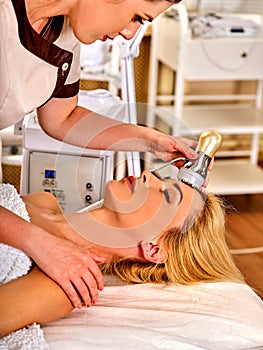 Skin resurfacing procedure facial procedure on ultrasound face machine. photo