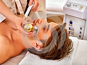 Skin resurfacing procedure facial procedure on ultrasound face machine. photo