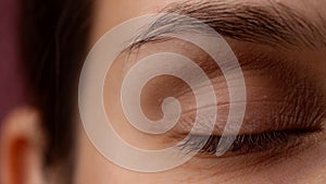 Portrait vision, macro camera shot of beautiful caucasian woman model face part. Closeup of female closed eye and face