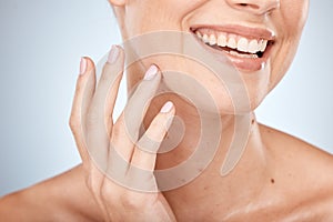 Skincare, beauty and closeup of mouth, woman with smile on face, luxury care for smooth skin on studio background