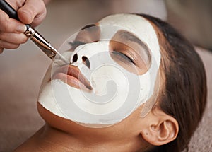 Skincare, brush and woman with face mask at spa for glow, wellness and beauty routine with self care. Cosmetic, natural