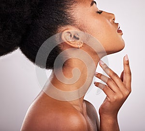 Skincare, cosmetics and profile of black woman with confidence, white background and beauty product. Health, dermatology