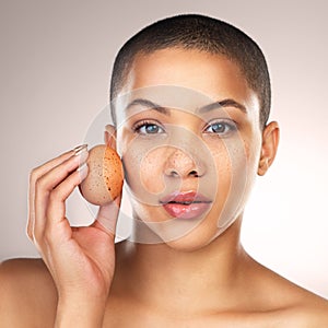 Skincare, egg and portrait of woman in studio for natural, hydration and facial treatment. Wellness, health and female