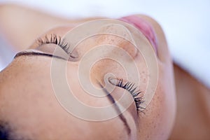 Skincare, face and woman with eyelash extension in spa or salon. Facial treatment or cosmetics, marketing or
