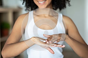 Skincare For Hands. Unrecognizable Black Woman Enjoying Her Soft Moisturized Skin, Cropped Image With Selective Focus,