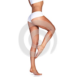 Skincare, legs and woman on mockup in studio for grooming, smooth and soft against a white background. Body care, leg