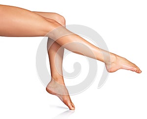 Skincare, legs and woman in studio for beauty, smooth and cosmetic, grooming or treatment on white background. Smooth