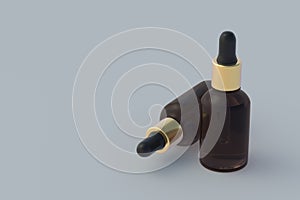 Skincare serum in dropper bottles on gray background. Copy space