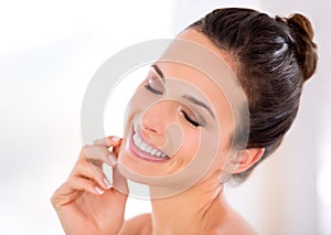 Skincare, smooth and happy woman with beauty in home with shine, smile and luxury skin treatment. Dermatology, relax or