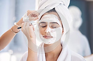 Skincare, spa and woman with mask for facial care, beauty and wellness with beautician using face brush. Cosmetics