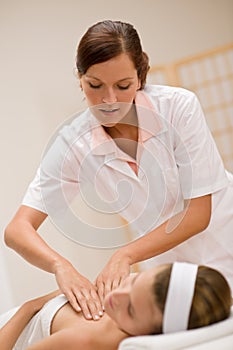 Skincare - woman cleavage massage at salon