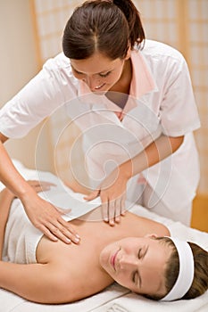 Skincare - woman cleavage massage at salon