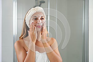 Skincare woman washing face foaming soap scrubbing skin. Face wash exfoliation scrub soap woman washing scrubbing with skincare