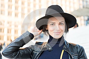 Skincare, youth, visage. Woman in black hat smile on stairs in paris, france, fashion. Beauty, look, makeup. Fashion, accessory, s