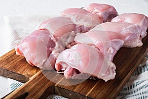 Skinless  chicken thighs on white background
