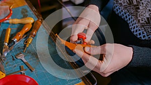 Skinner working with leather belt