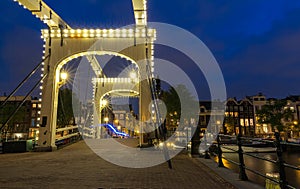 The Skinny Bridge Magere Brug at night, Amsterdam, Holland, Europe.