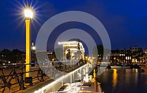 The Skinny Bridge Magere Brug at night, Amsterdam, Holland, Europe.