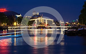 The Skinny Bridge Magere Brug at night, Amsterdam, Holland, Europe.