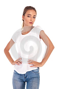 Skinny casual woman with hands on waist