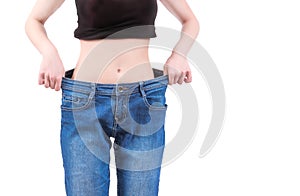 Skinny girl and baggy jeans photo