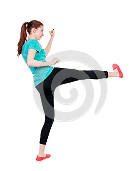 Skinny woman funny fights waving his arms and legs.