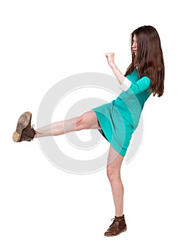 Skinny woman funny fights waving his arms and legs.