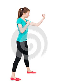 skinny woman funny fights waving his arms and legs. Girl in sportswear in sparring