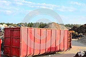 Skip for dumping renovation waste. Metal tanks and capacities for storage and transportation of garbage. photo