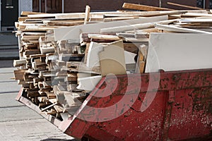 Skip loaded with old wood