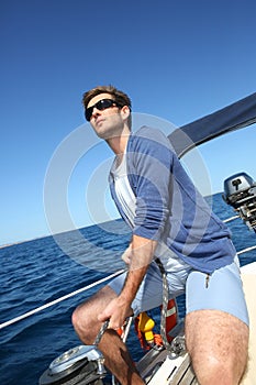 Skipper navigating boat