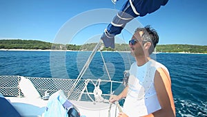 Skipper on sailing boat on Adriatic sea off the coasts of Croatia.