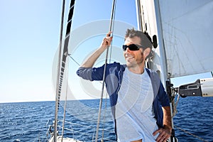 Skipper standing on sailing boat