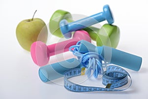 Skipping rope and barbells in green, blue and pink