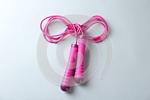 Skipping rope on white background, top view. Sports equipment