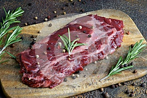 Skirt steak on a wooden background