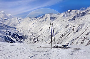 Skis and ski poles in Alps