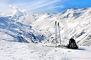 Skis, ski poles and backpack in Alps