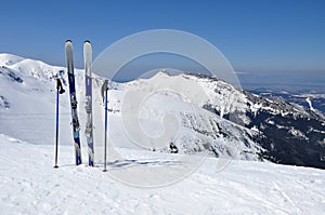 Skis, ski poles and Giewont in Tatra mountains photo