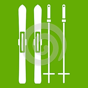Skis and ski poles icon green