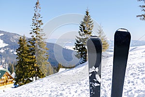 skis on snow hill mountain,winter alpine ski resort,extreme sport holiday winter Carpathian mountain panoramic scenic