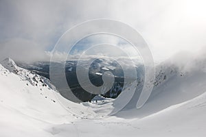 Skitouring with beautiful view of mountains in beautiful winter powder snow.